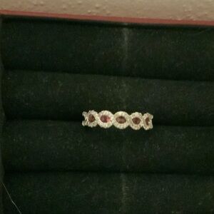 Elegant Silver and Red Gemstone Infinity Ring